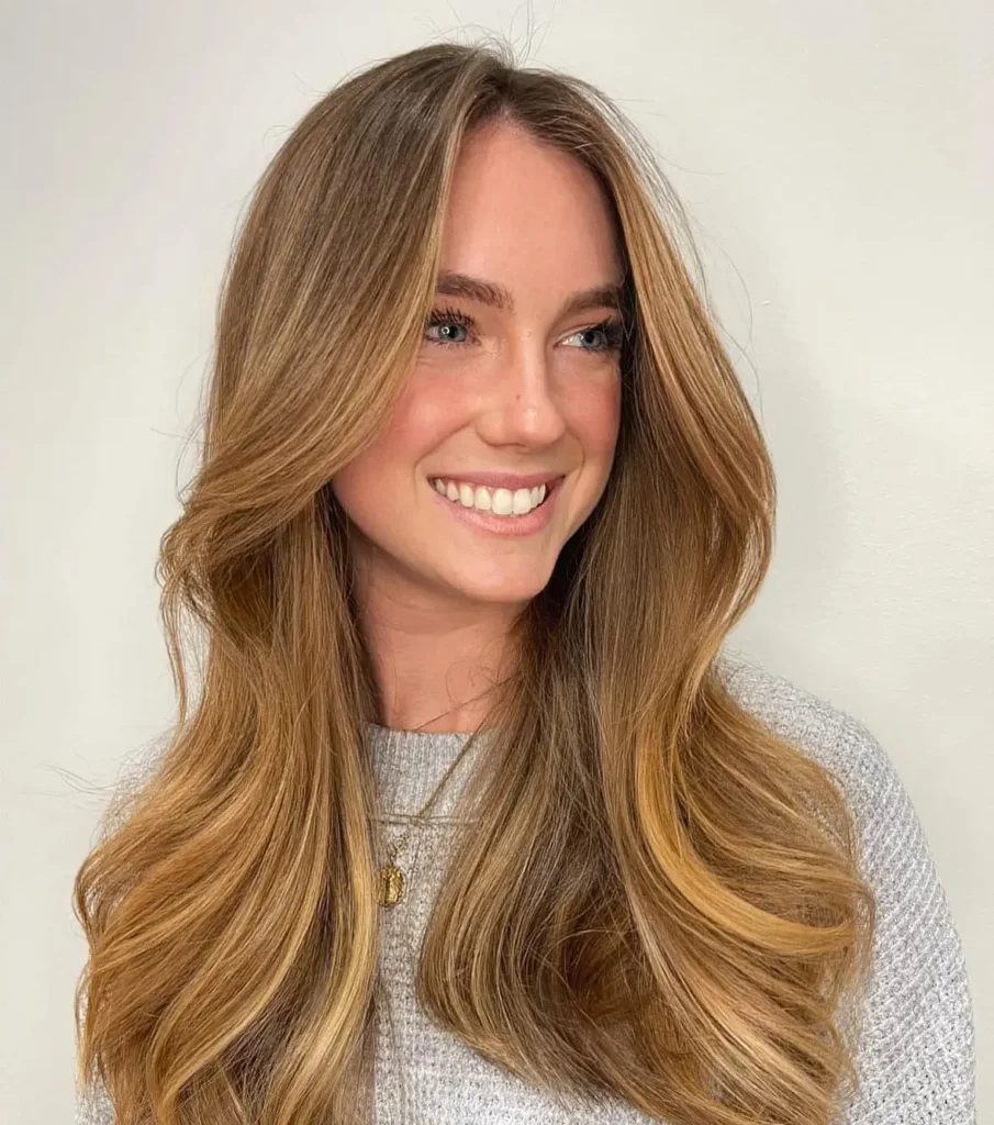 smiling woman with long copper-colored hair